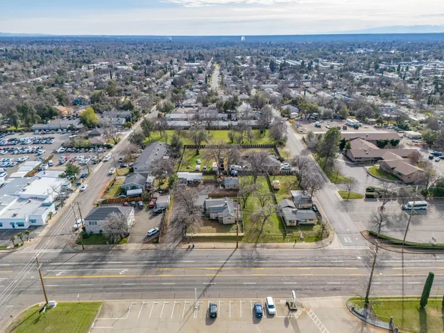 an aerial view of residential houses with outdoor space