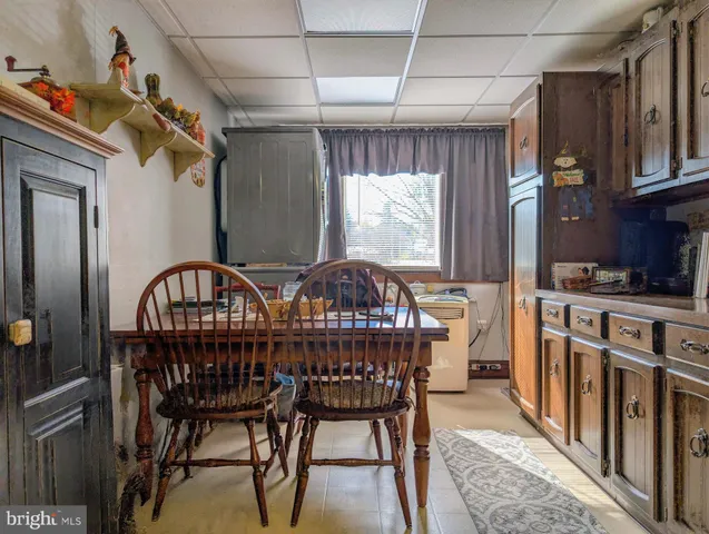 a view of a chairs and table in kitchen