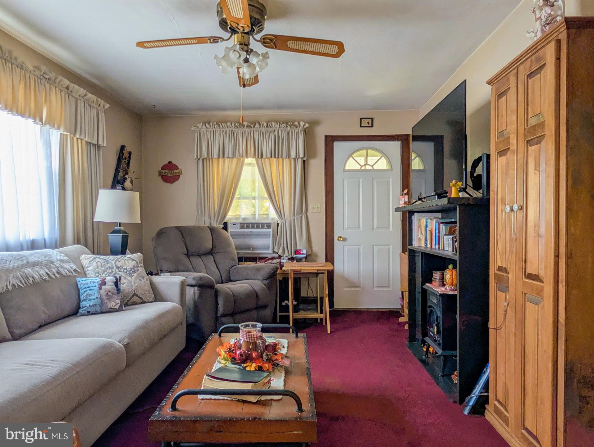 83 State Street Everett, PA 15537 - Photo 14 of 39 a living room with furniture and a window