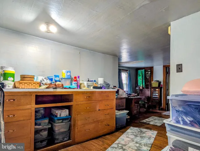 a kitchen with a sink and a stove top oven
