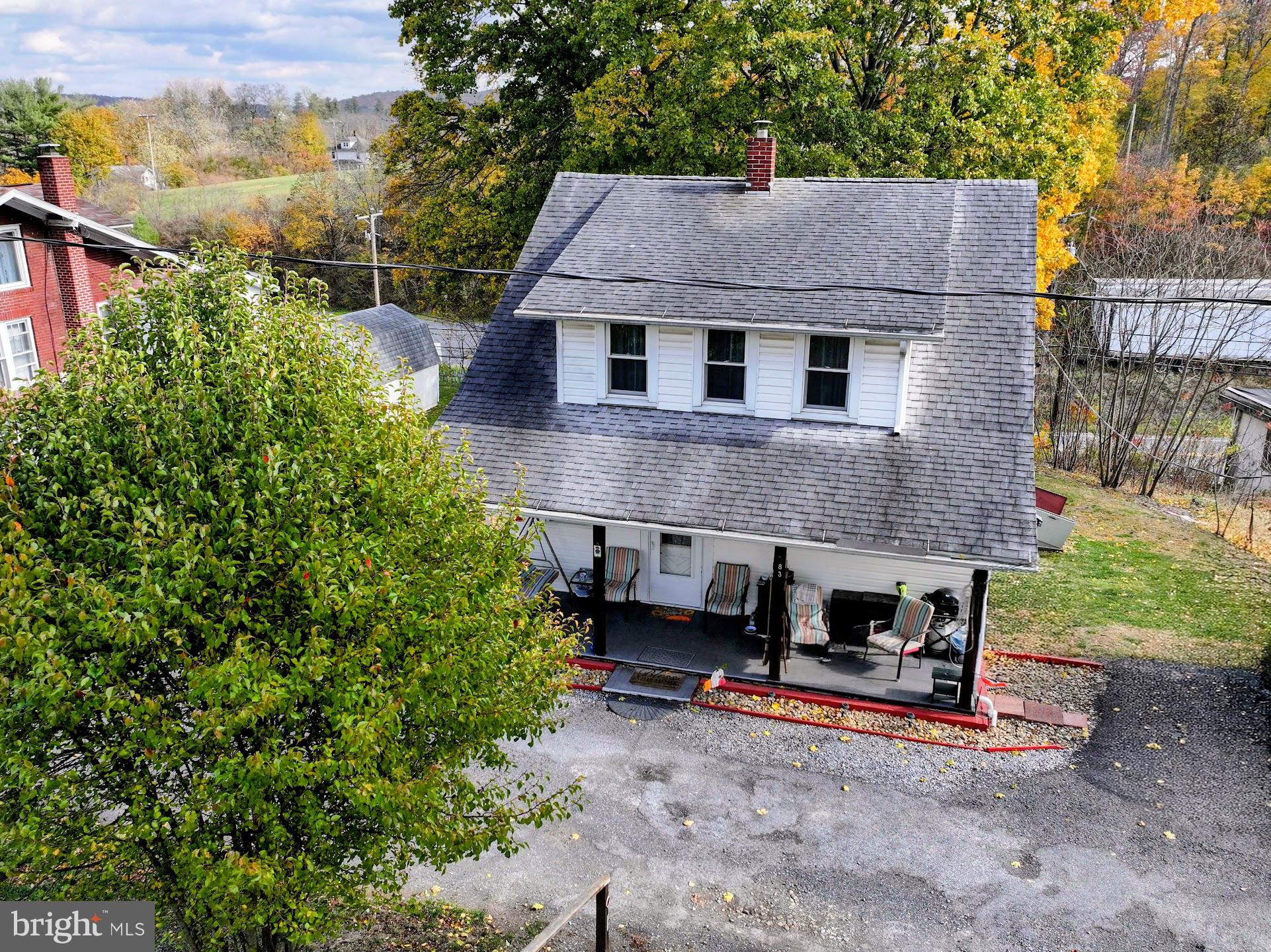 83 State Street Everett, PA 15537 - Photo 35 of 39 a aerial view of a house with a yard and sitting area