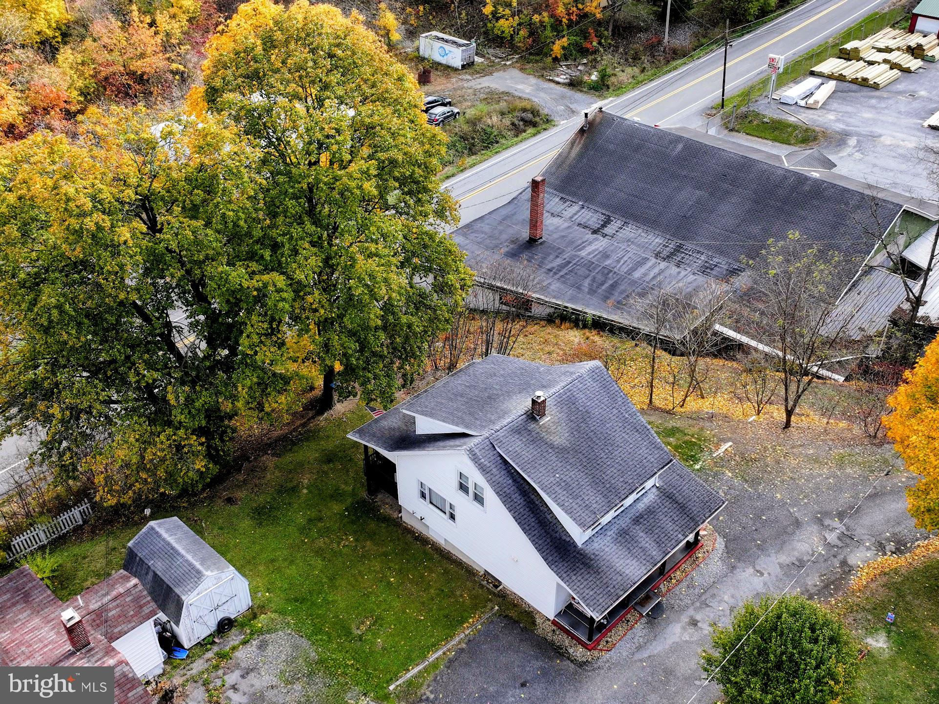 83 State Street Everett, PA 15537 - Photo 36 of 39 an aerial view of a house with a yard