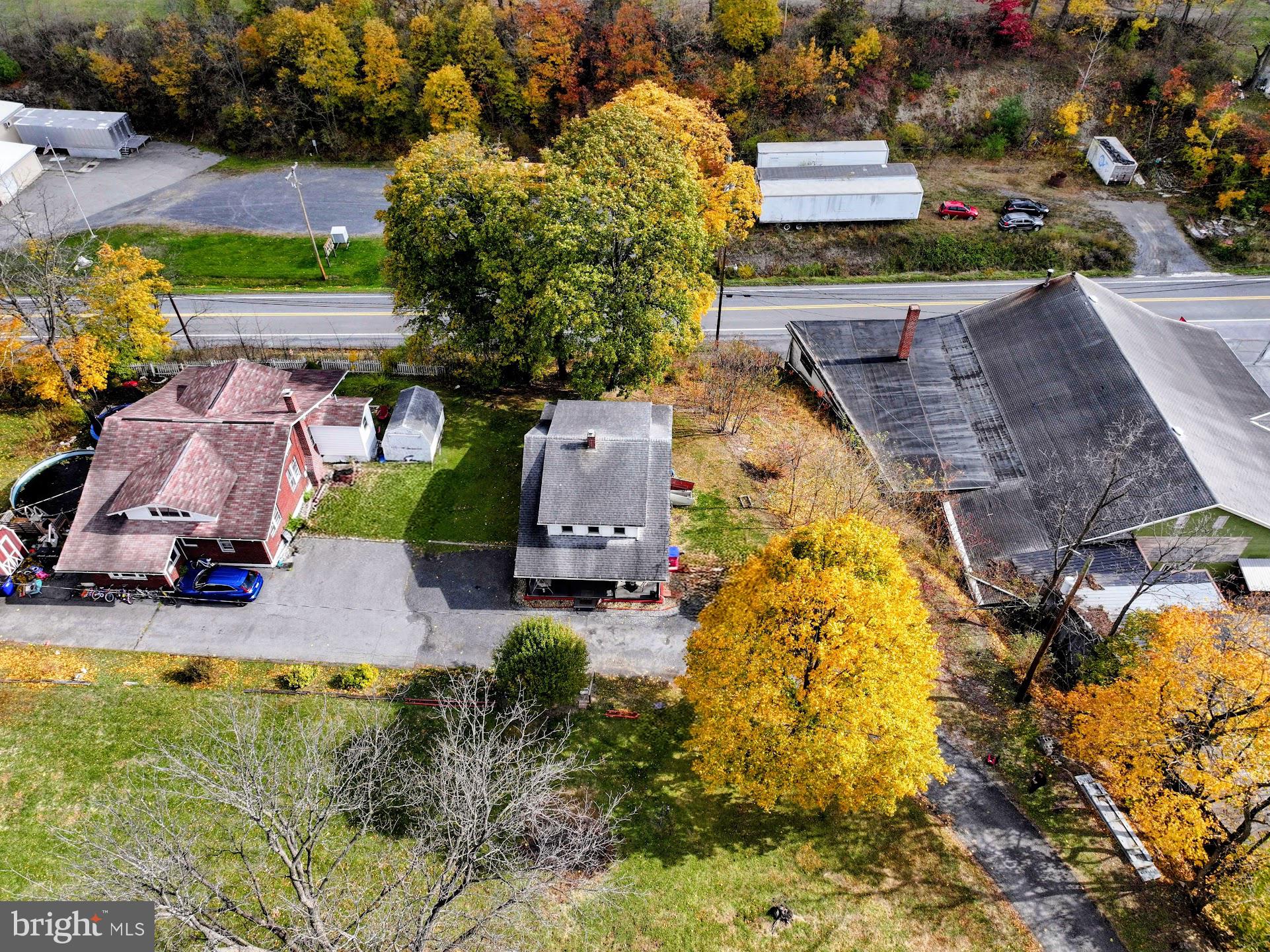 83 State Street Everett, PA 15537 - Photo 39 of 39 an aerial view of a house with swimming pool and large trees