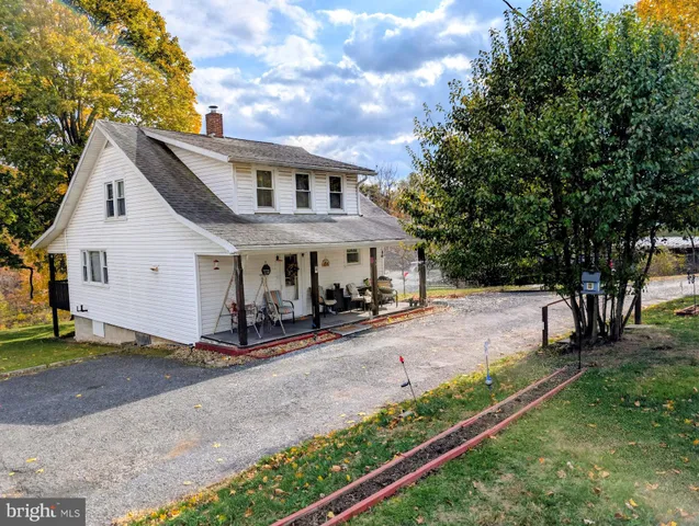 a view of house with yard