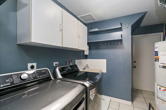 a utility room with cabinets