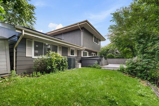 a house view with a sitting space and garden
