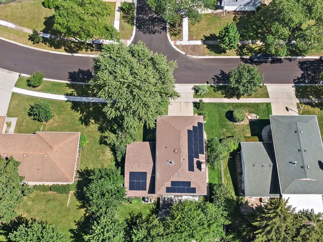 an aerial view of house with a yard