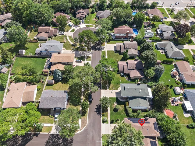 an aerial view of houses with yard