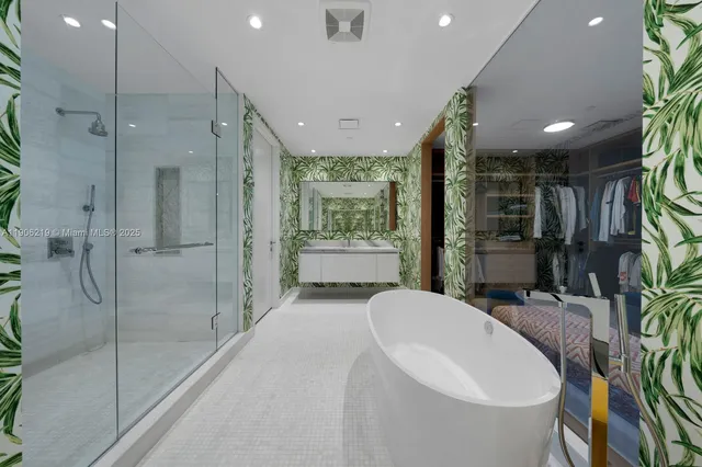 a bathroom with a bathtub shower sink and mirror