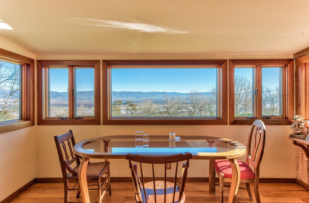 1352 C River Road Salinas, CA 93908 - Photo 15 of 35 a view of a dining room with furniture large windows and wooden floor