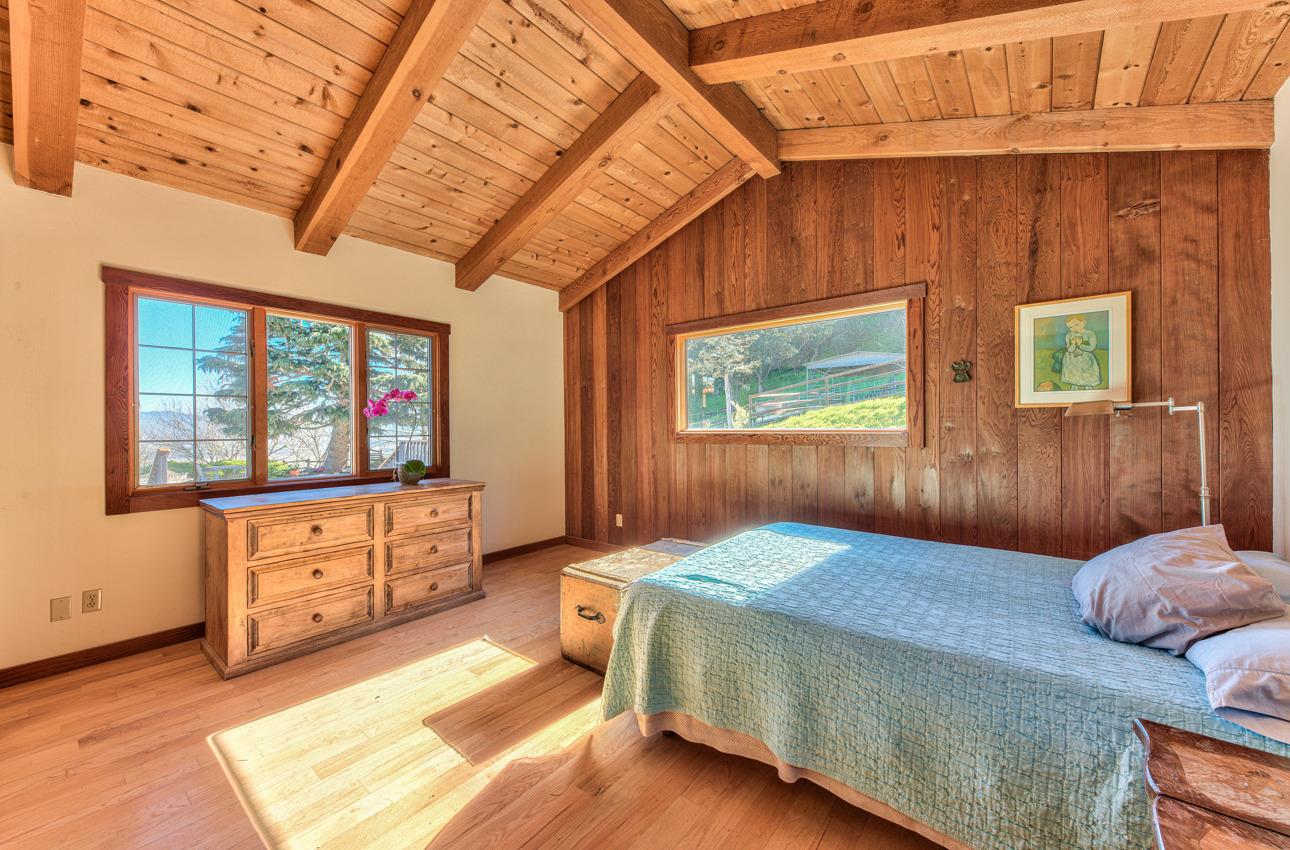 1352 C River Road Salinas, CA 93908 - Photo 24 of 35 a bedroom with a bed and a dresser next to a window