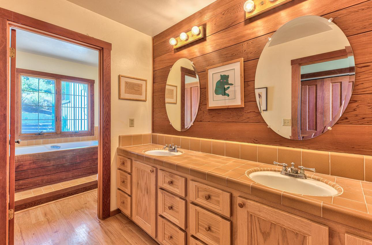 1352 C River Road Salinas, CA 93908 - Photo 26 of 35 a bathroom with a granite countertop double vanity sink and a large mirror