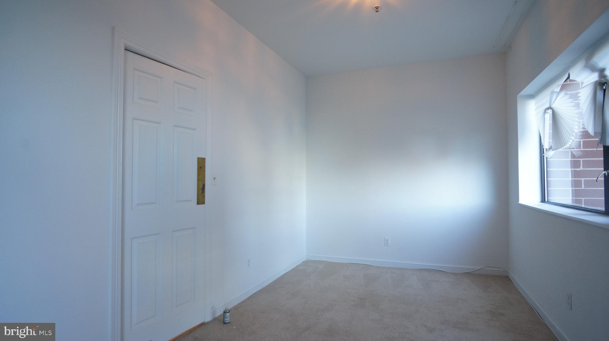 10 East Lee Street, Unit 705 Baltimore, MD 21202 - Photo 12 of 48 an empty room with a window