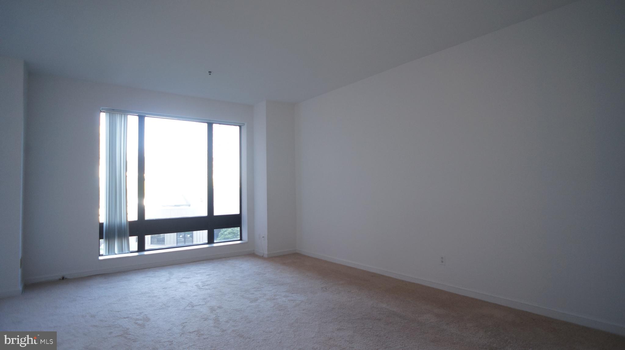 10 East Lee Street, Unit 705 Baltimore, MD 21202 - Photo 17 of 48 an empty room with a window