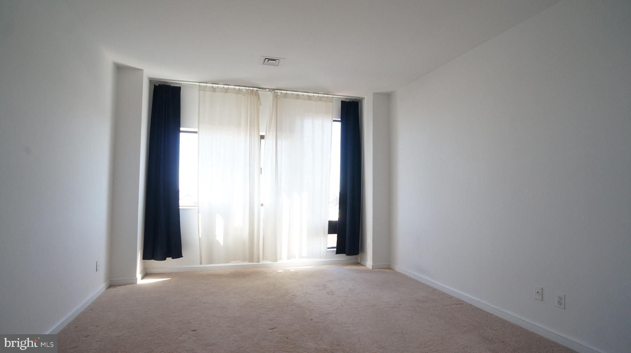 10 East Lee Street, Unit 705 Baltimore, MD 21202 - Photo 18 of 48 an empty room with closet
