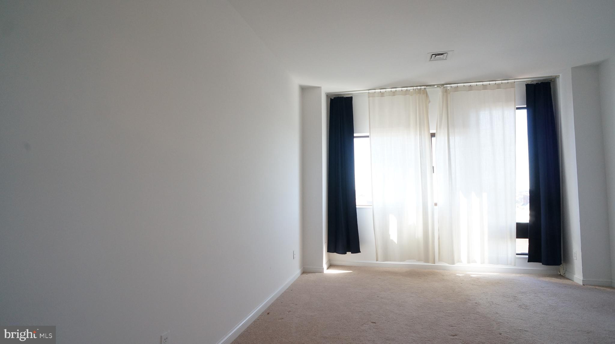 10 East Lee Street, Unit 705 Baltimore, MD 21202 - Photo 19 of 48 a view of an empty room