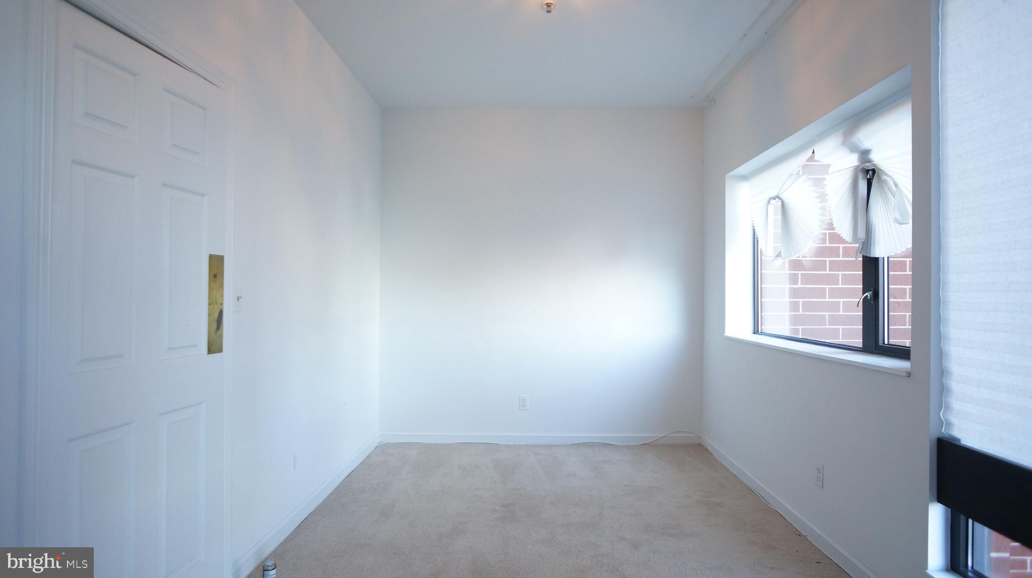 10 East Lee Street, Unit 705 Baltimore, MD 21202 - Photo 34 of 48 an empty room with windows