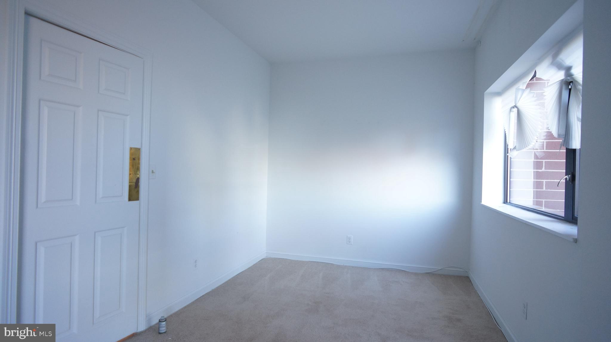 10 East Lee Street, Unit 705 Baltimore, MD 21202 - Photo 37 of 48 an empty room with windows