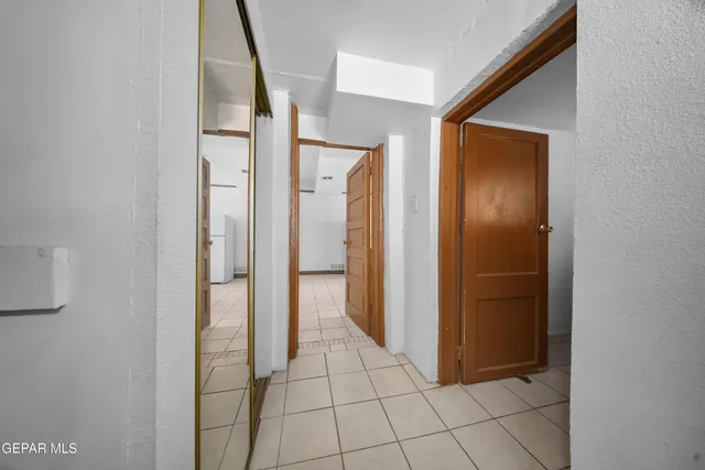 a kitchen with a stove top oven and cabinets