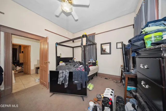 a bedroom with bed and a window