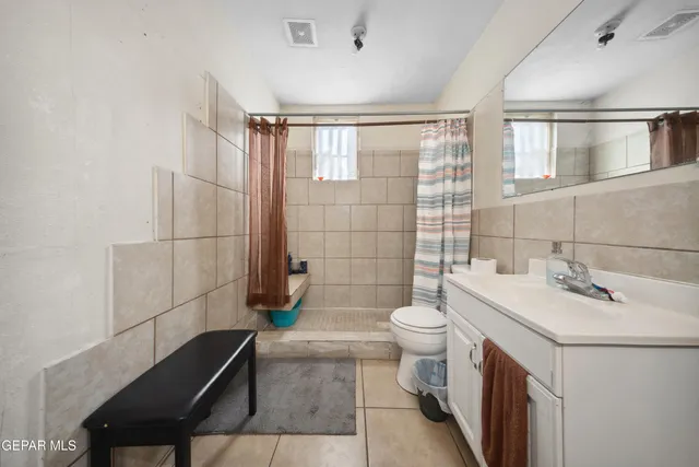 a dining table with chairs and chandelier