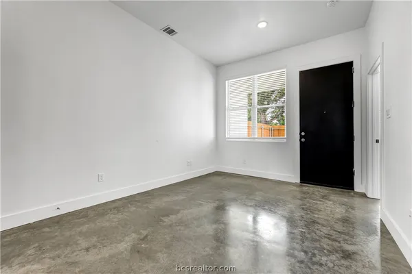 an empty room with windows