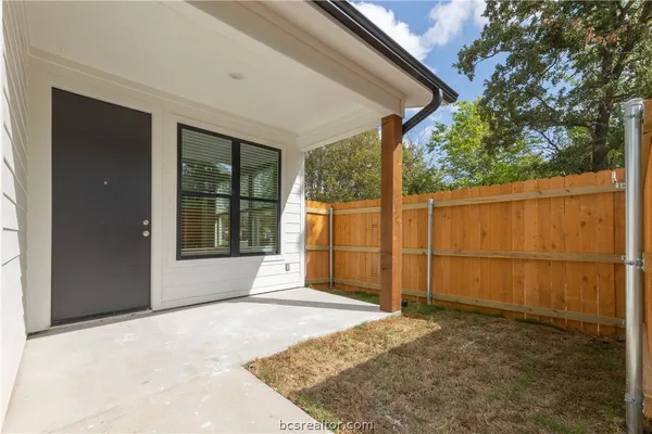 a view of a backyard of the house