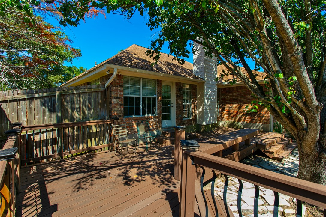 2817 Brandywine Circle Bryan, TX 77807 - Photo 27 of 28 a view of a house with large windows and a table