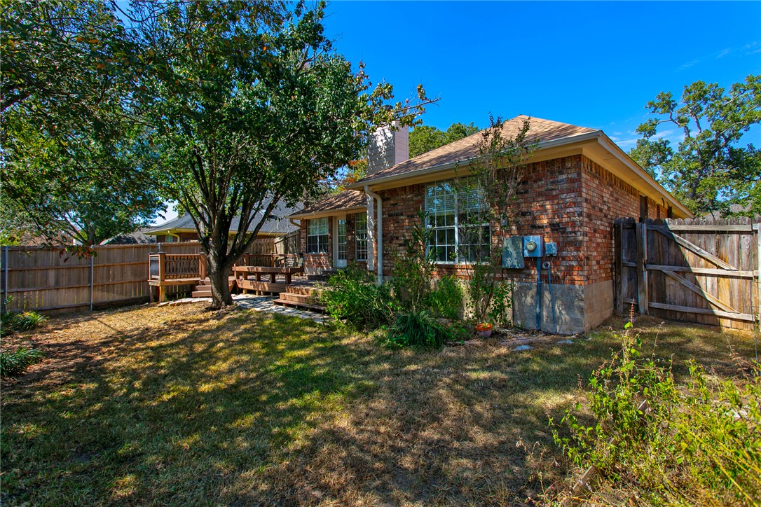 2817 Brandywine Circle Bryan, TX 77807 - Photo 28 of 28 a view of a house with a small yard and a large tree