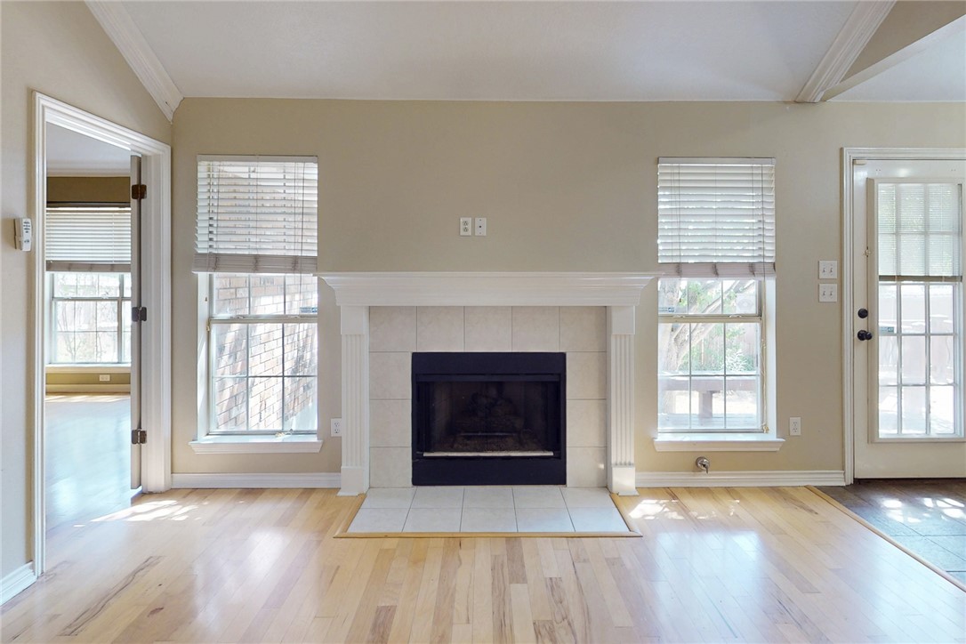 2817 Brandywine Circle Bryan, TX 77807 - Photo 5 of 28 an empty room with windows and fireplace