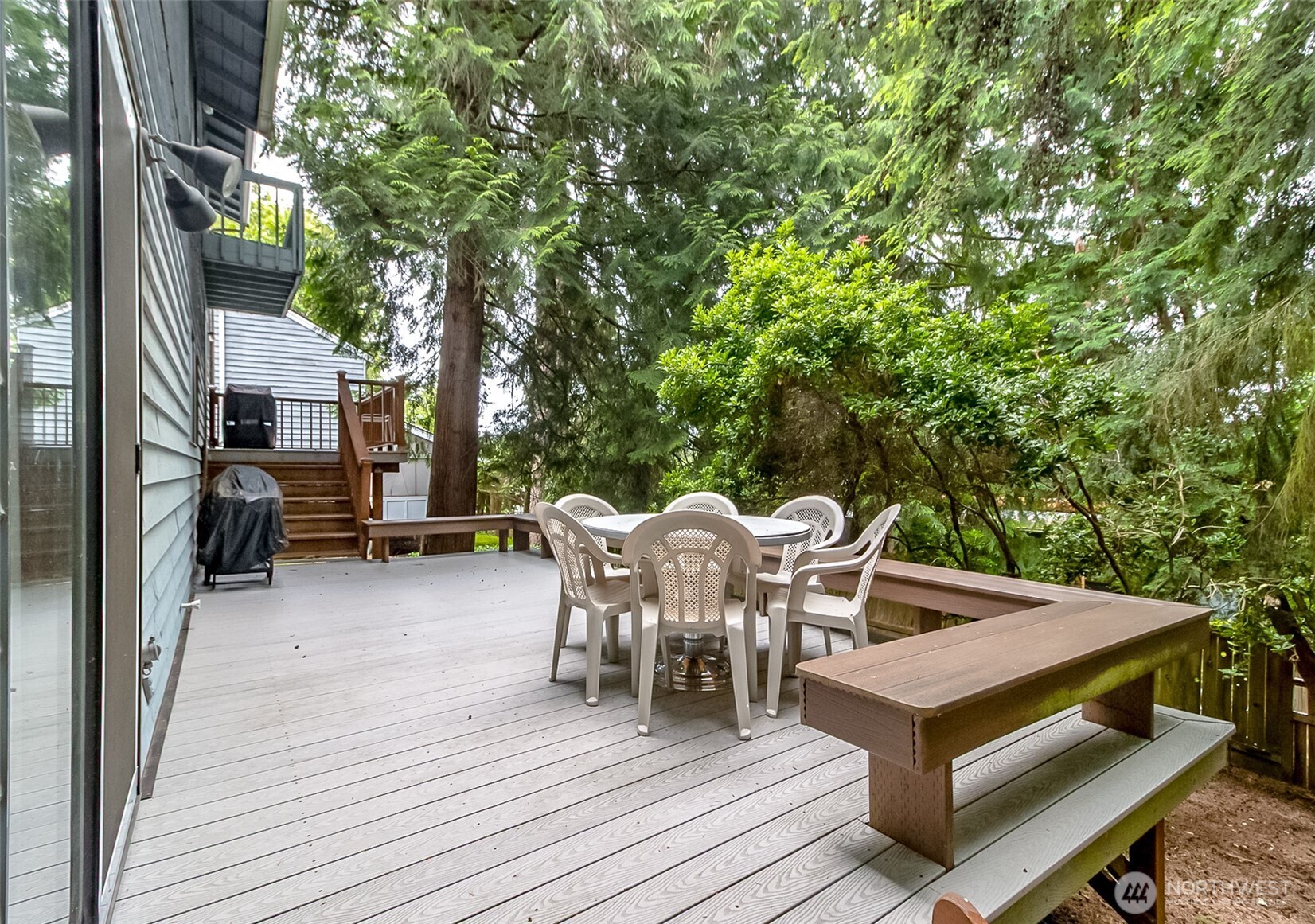 22121 4th Avenue Southeast Bothell, WA 98021 - Photo 22 of 22 a view of a patio with table and chairs and wooden floor