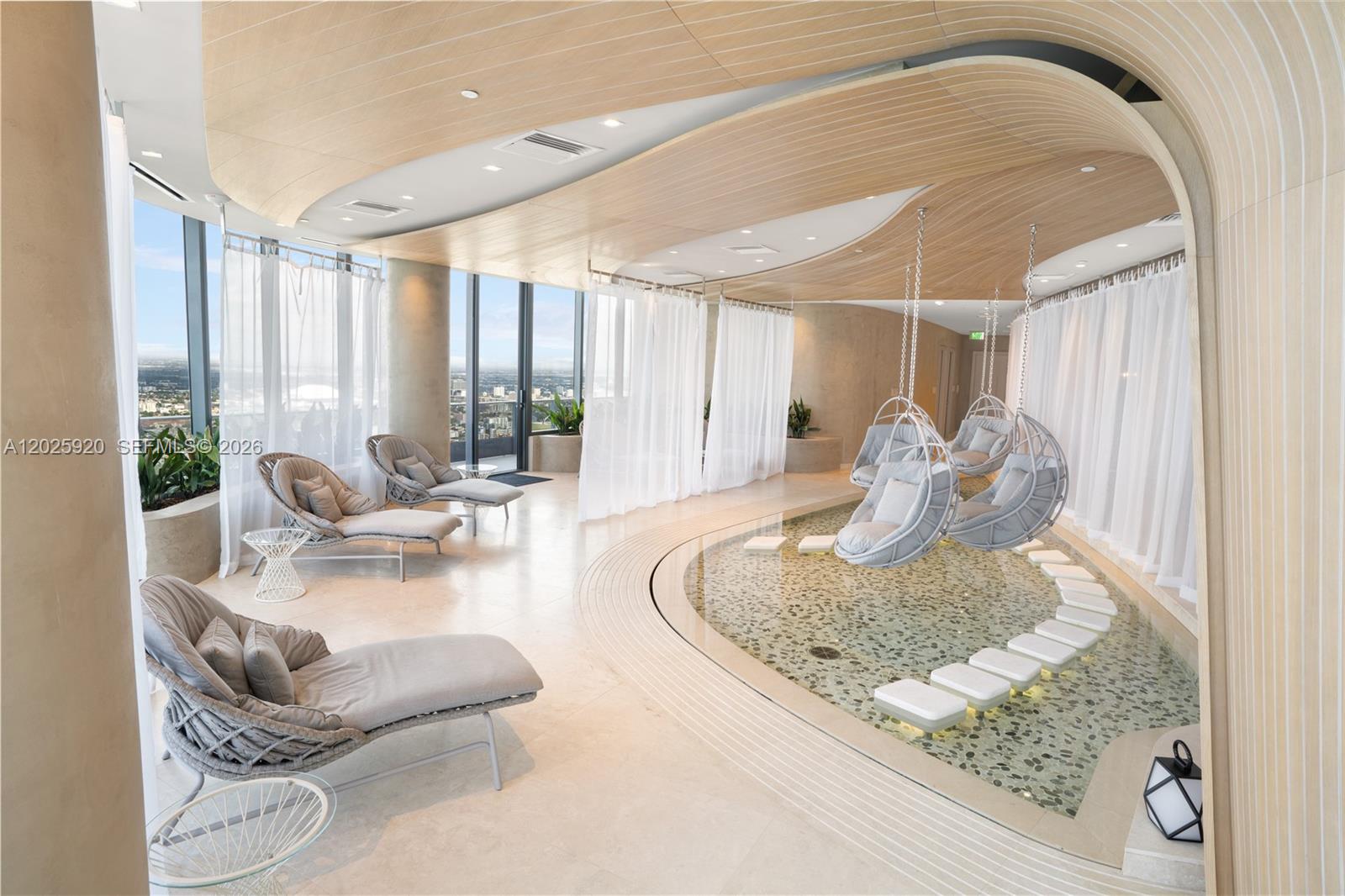 1000 Brickell, Unit 2014 Miami, FL 33131 - Photo 13 of 30 a living room with furniture and a large window