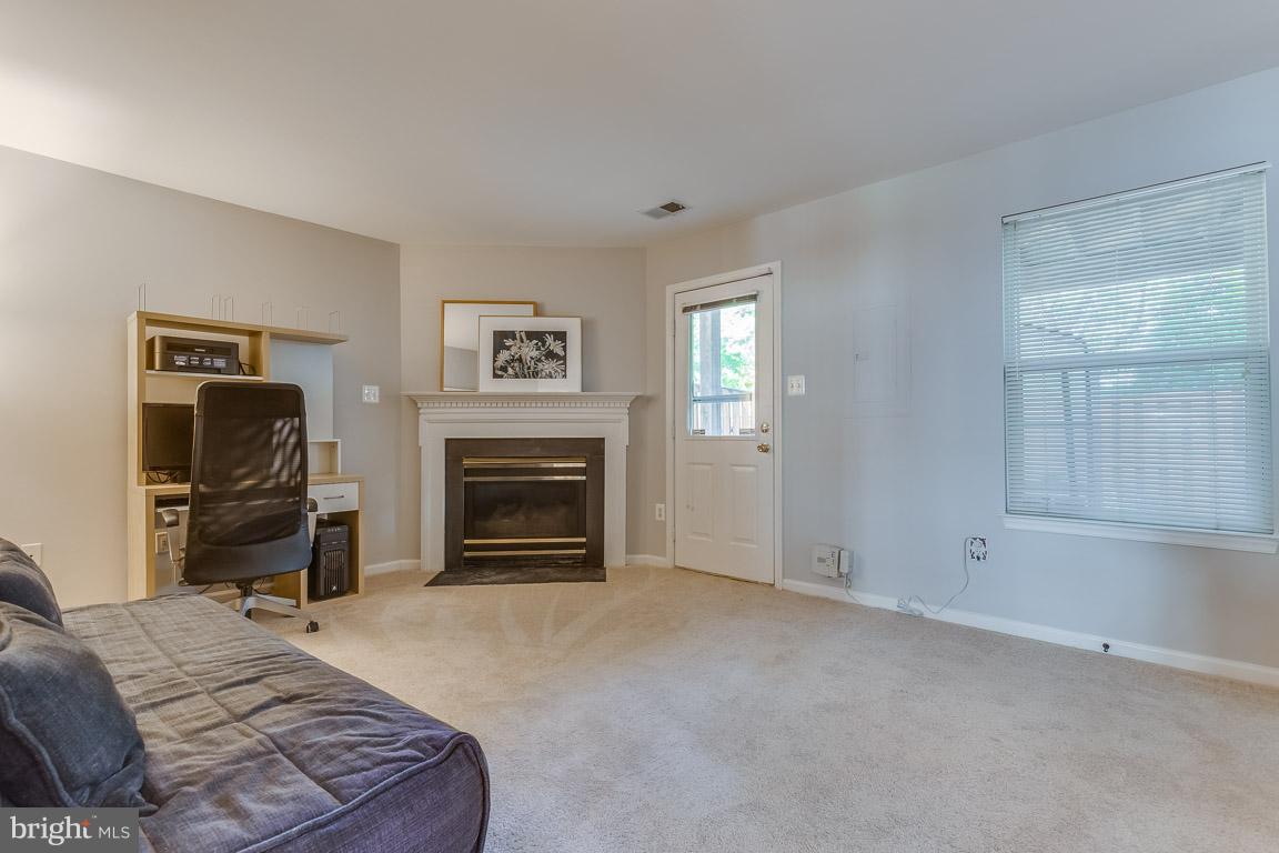 14817 Edman Road Centreville, VA 20121 - Photo 26 of 30 Recreation room with gas fireplace and walk out