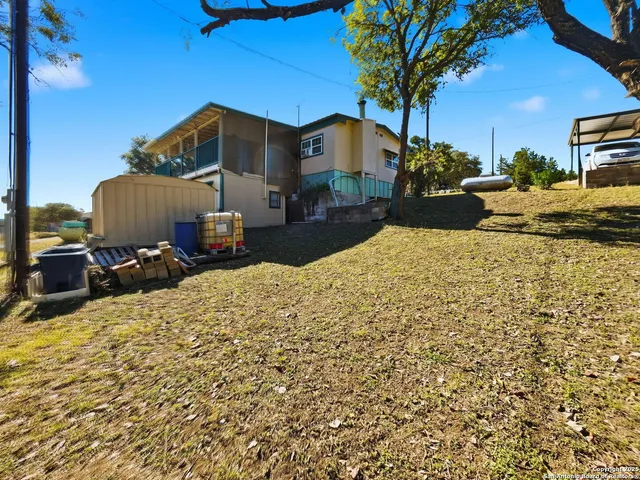 a view of a backyard of the house
