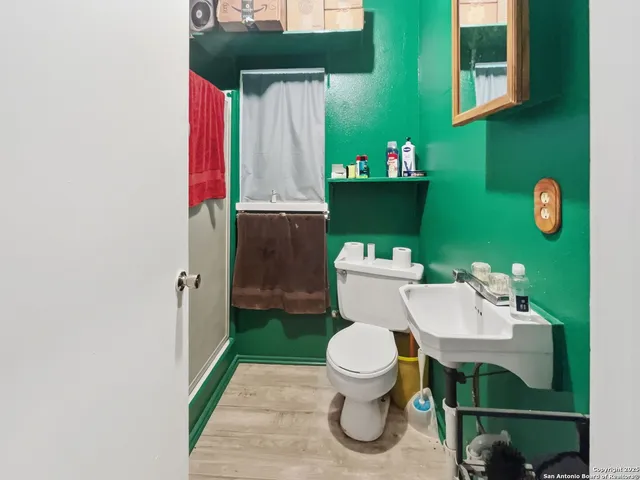 a bathroom with a toilet and a sink