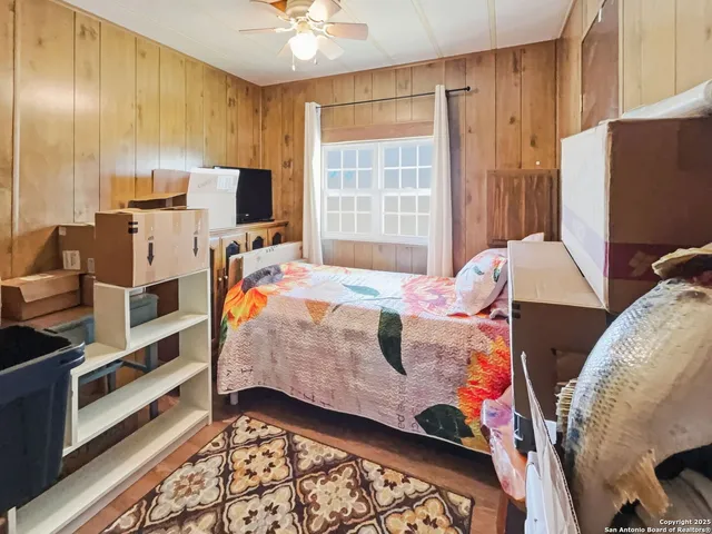 a bedroom with bed and window
