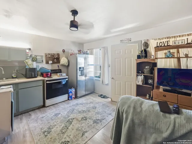 a kitchen with refrigerator and window