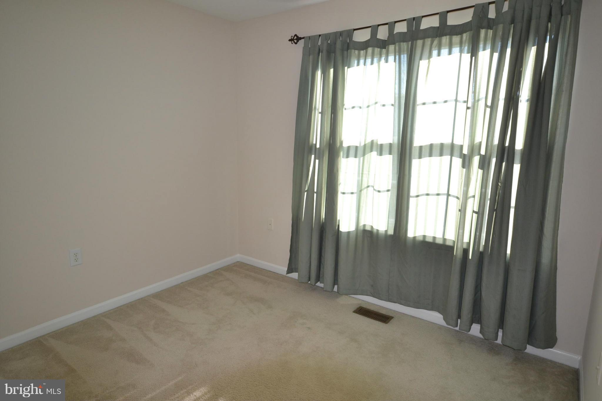 2629 Caulfield Court Frederick, MD 21701 - Photo 14 of 17 an empty room with a large window
