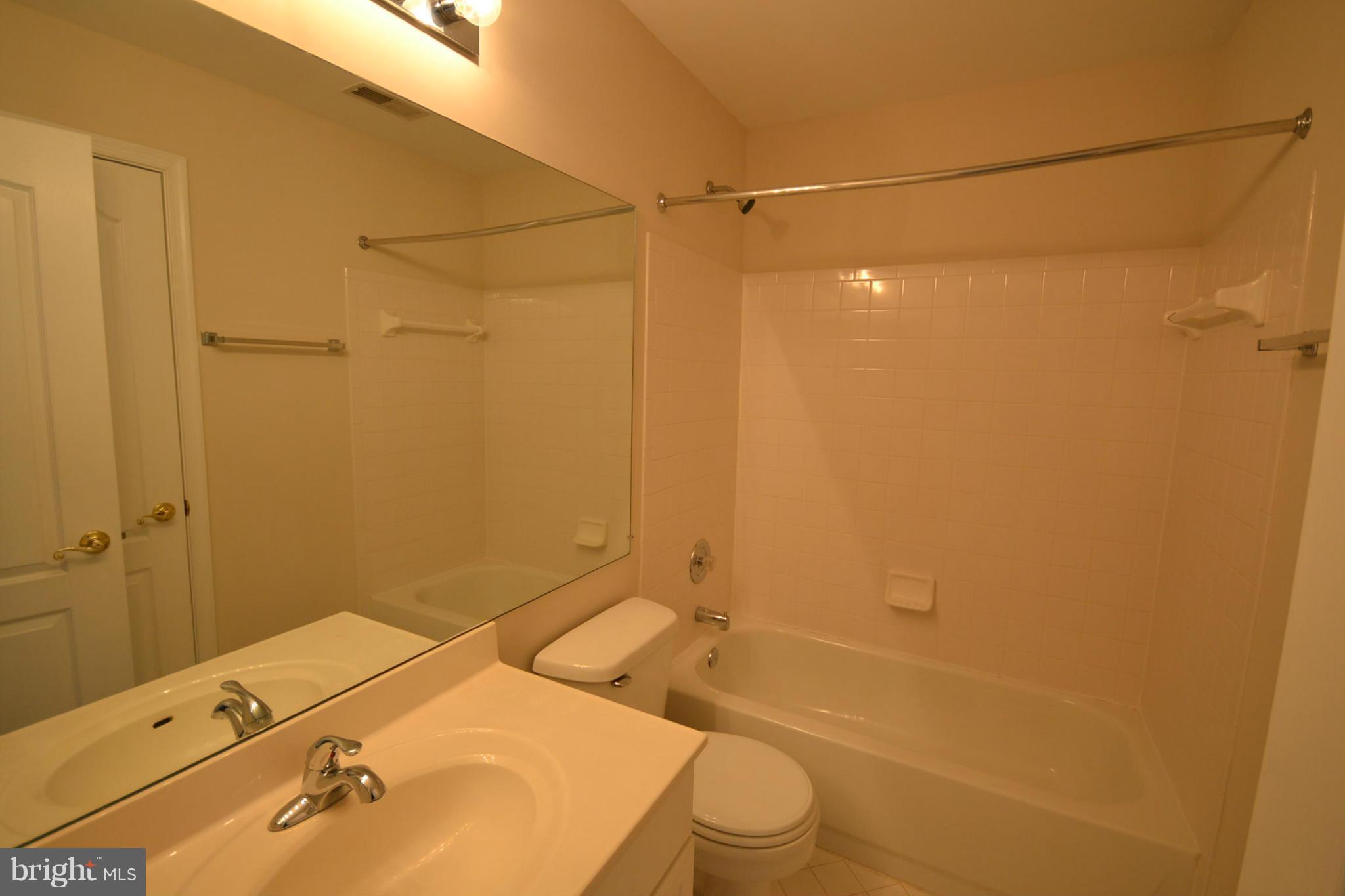 2629 Caulfield Court Frederick, MD 21701 - Photo 15 of 17 a bathroom with a sink toilet and shower