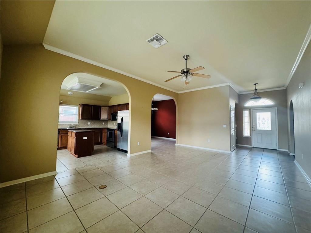 7541 Exeter Corpus Christi, TX 78414 - Photo 2 of 13 a view of a kitchen with a sink and a living room