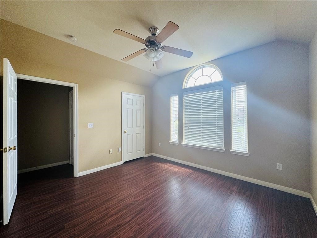 7541 Exeter Corpus Christi, TX 78414 - Photo 6 of 13 a view of an empty room with wooden floor and a window