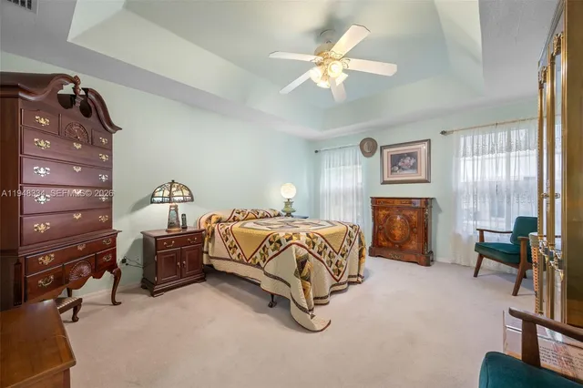 a bedroom with a bed and lamp