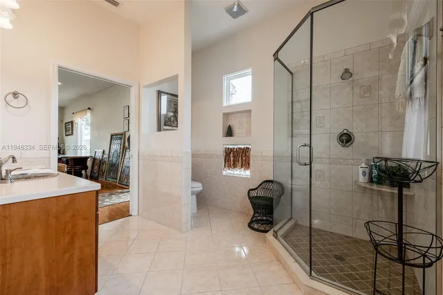 a kitchen with a refrigerator and a stove top oven