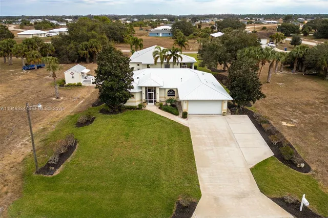 an aerial view of a house with a swimming pool