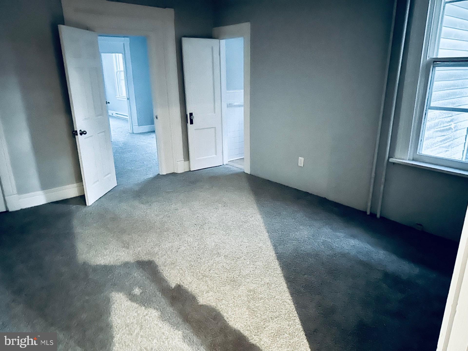222 Pine Street Steelton, PA 17113 - Photo 12 of 14 an empty room with wooden floor and windows