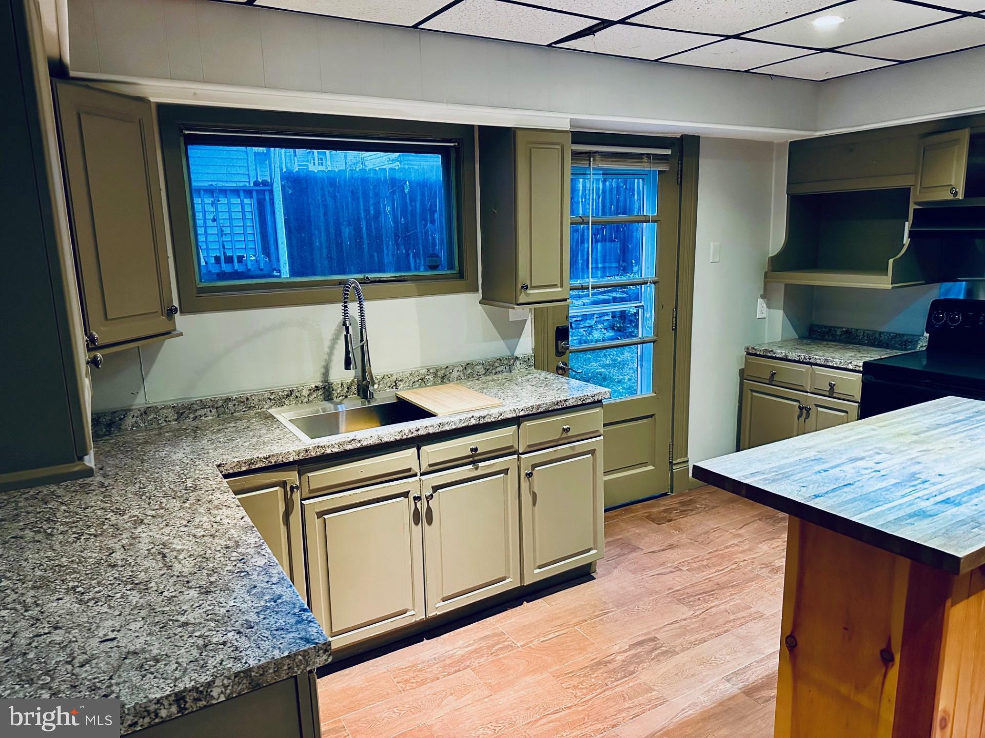 222 Pine Street Steelton, PA 17113 - Photo 2 of 14 a kitchen with stainless steel appliances granite countertop wooden cabinets and a counter top space