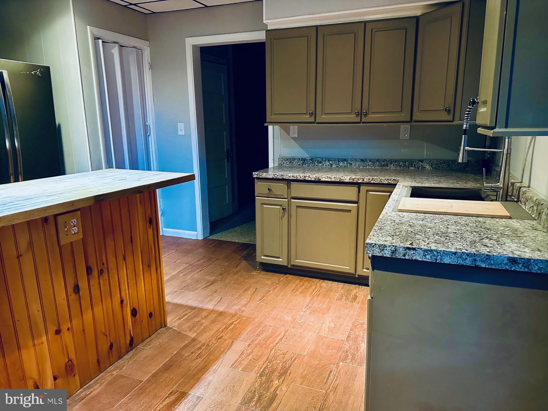 222 Pine Street Steelton, PA 17113 - Photo 3 of 14 a kitchen with granite countertop wooden cabinets a granite counter and a sink