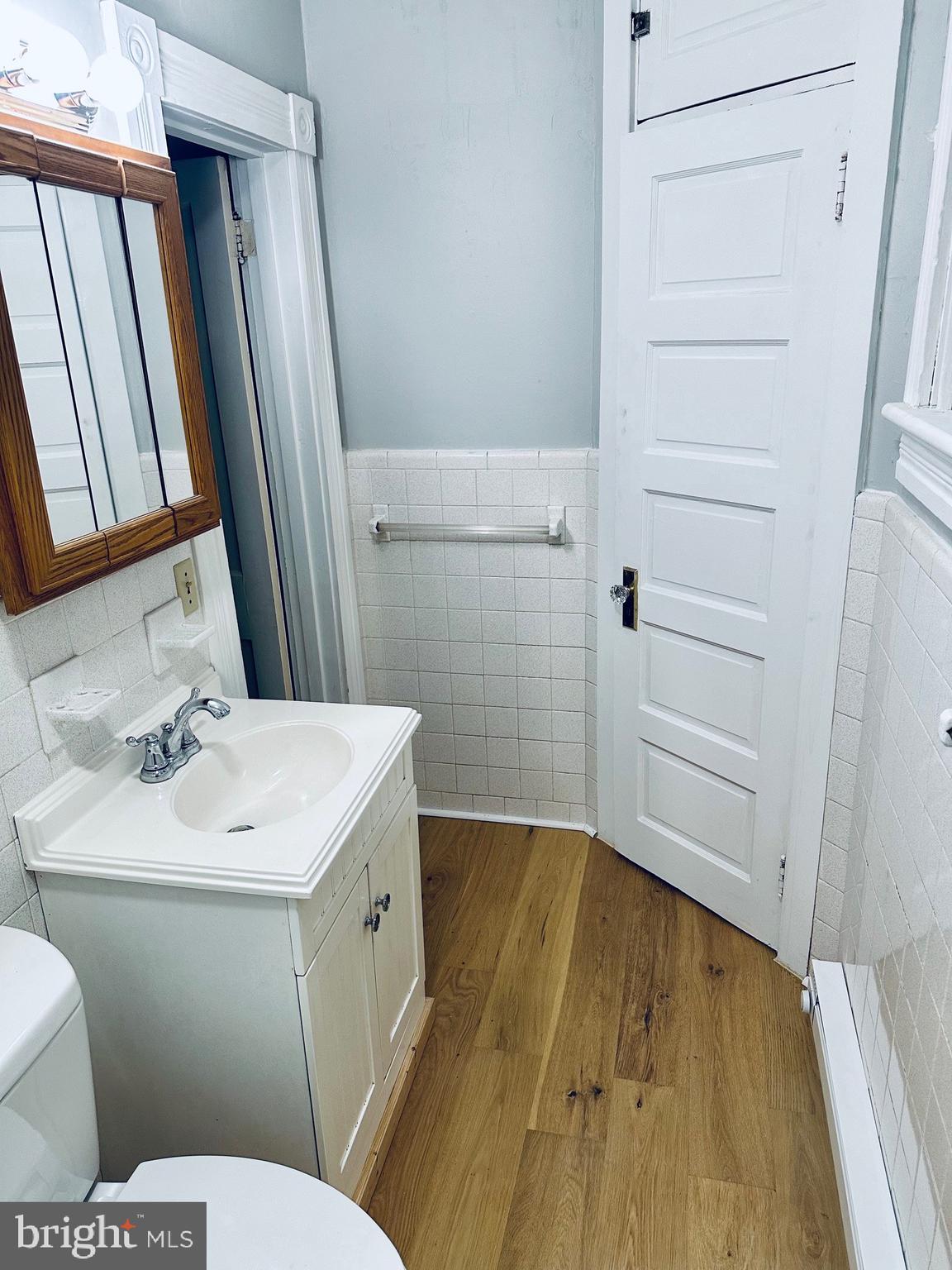 222 Pine Street Steelton, PA 17113 - Photo 7 of 14 a bathroom with a sink a toilet a vanity and mirror
