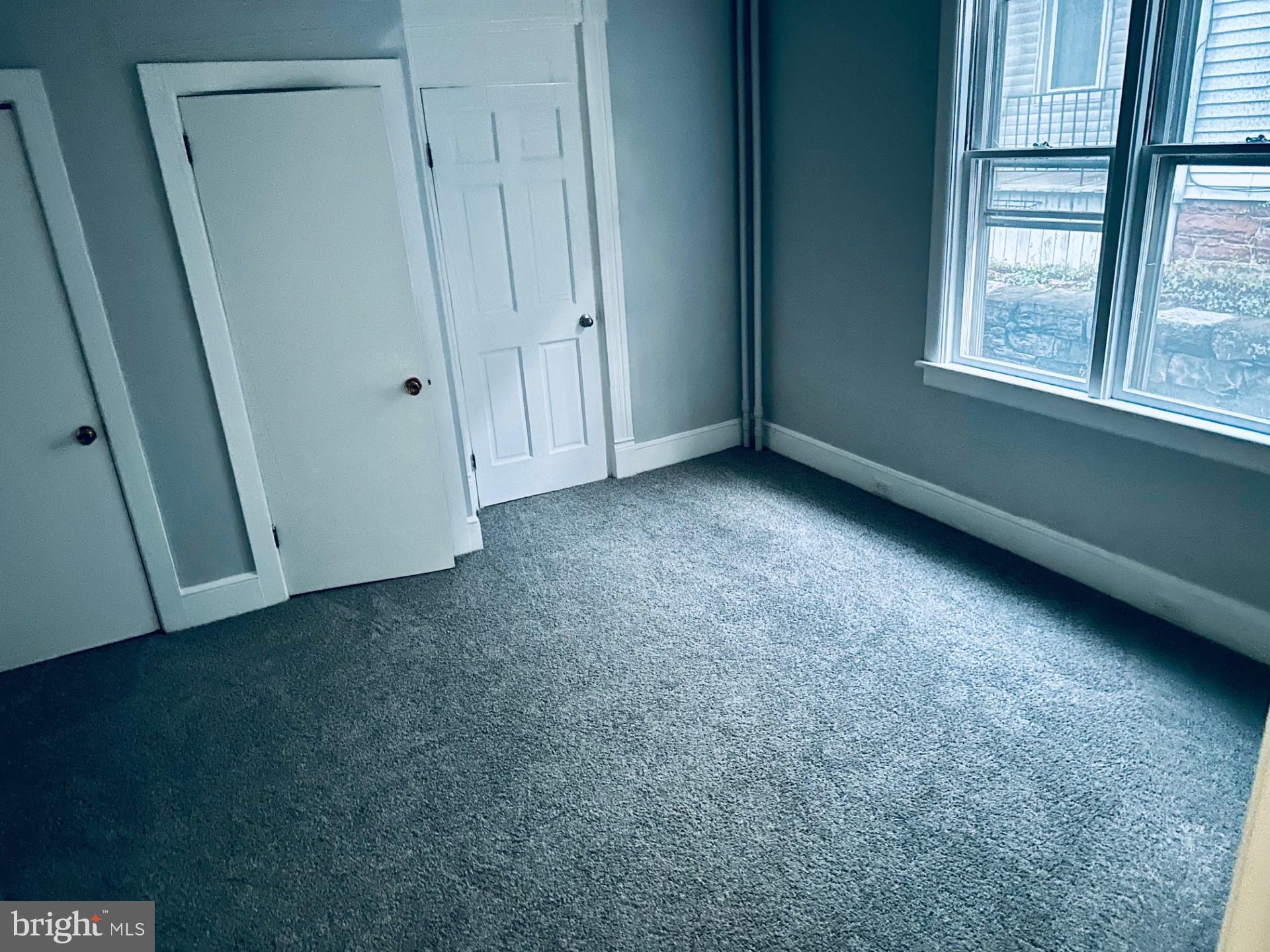 222 Pine Street Steelton, PA 17113 - Photo 10 of 14 an empty room with windows and closet