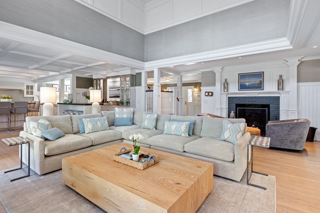 207 Pineleigh Path Barnstable, MA 02655 - Photo 13 of 42 a living room with furniture and a fireplace